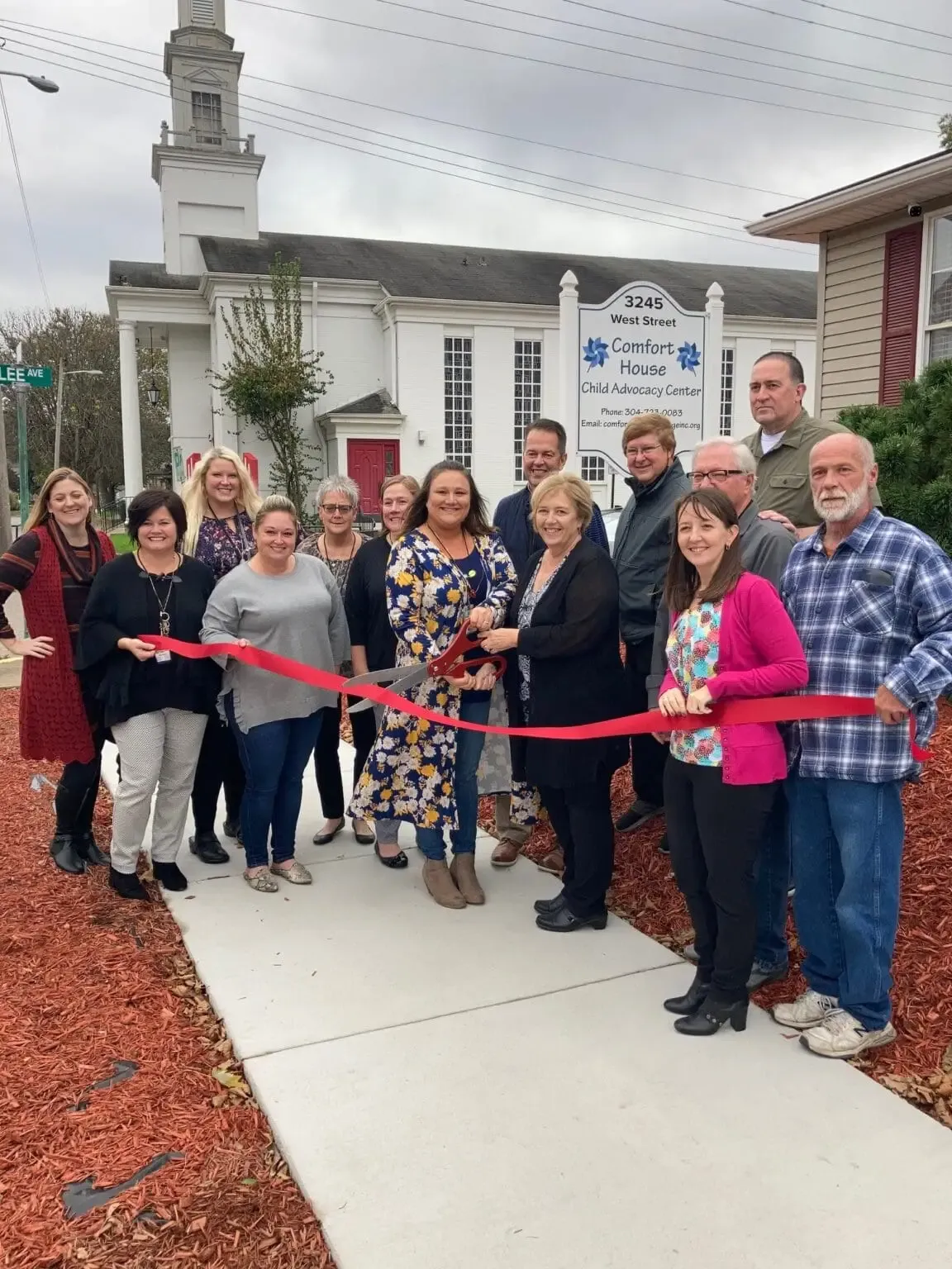 Ribbon cutting at the Comfort House open house