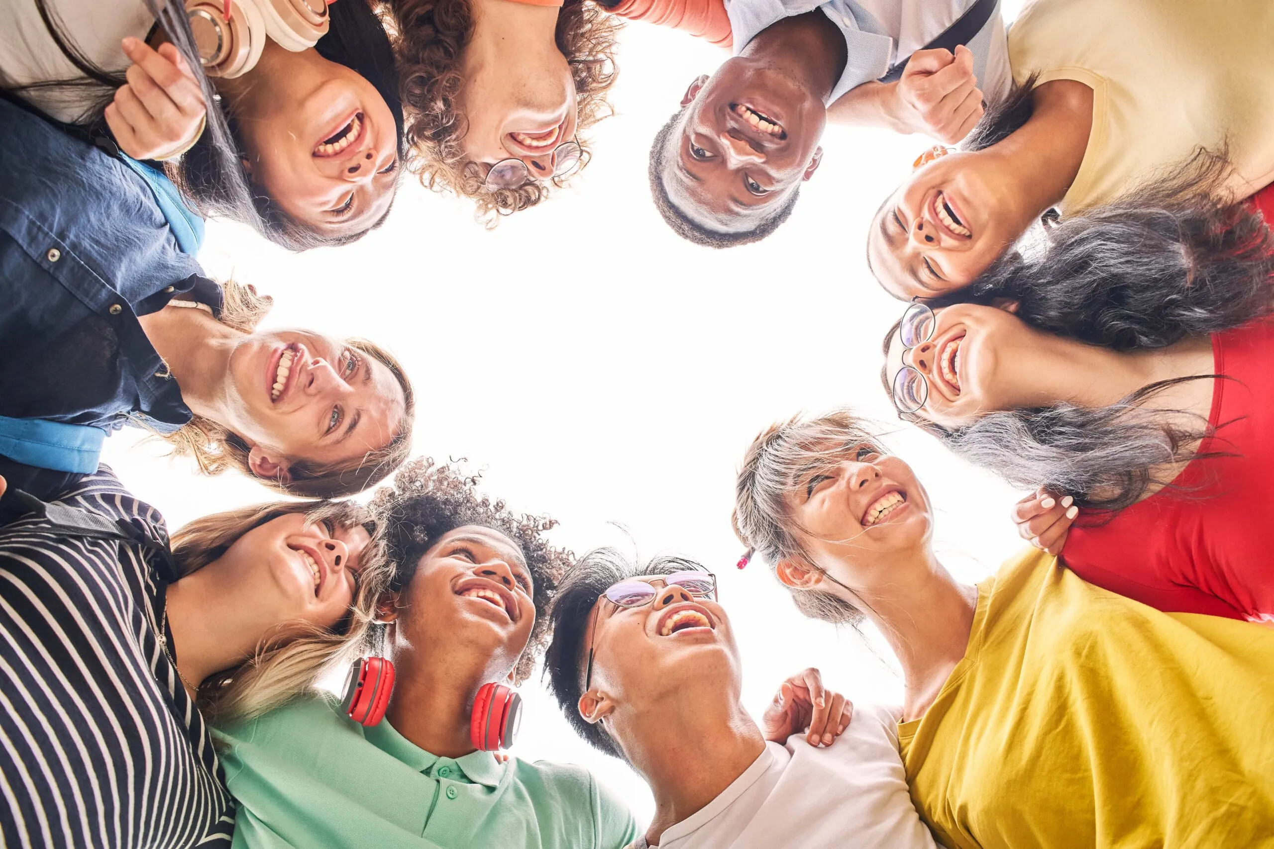 A group of friends smiling in a circle