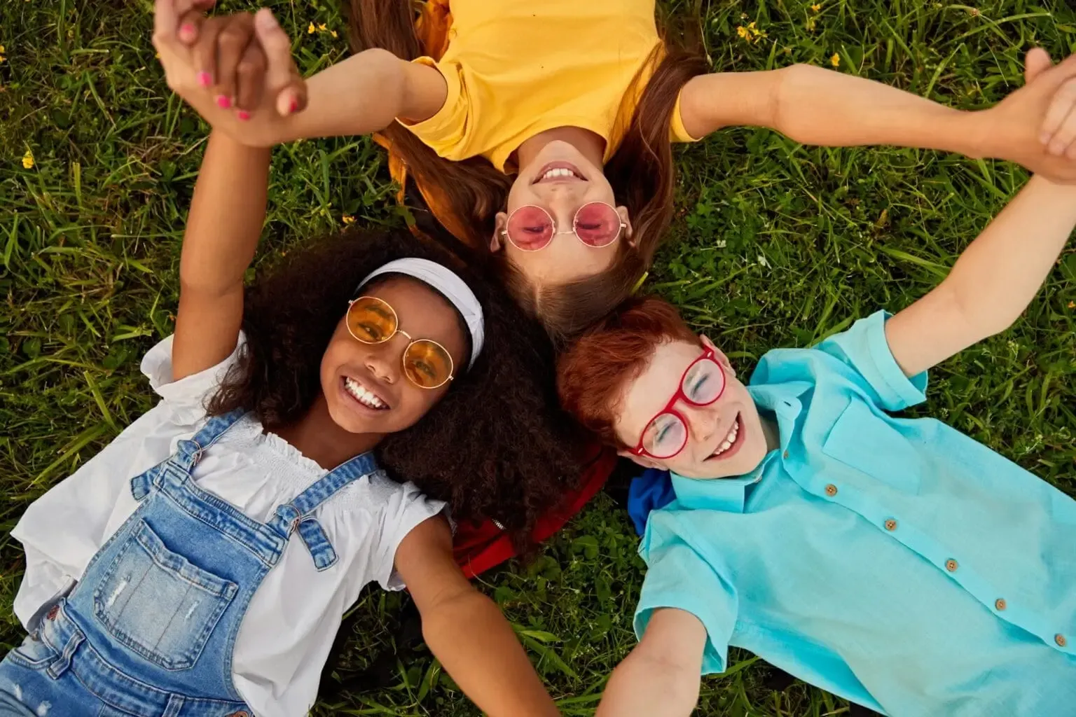 Children laughing together on the grass